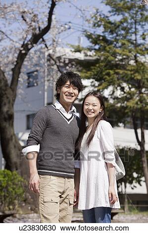 Young Couple in Park View Large Photo Image Stock Image - Young Couple in Park. Fotosearch