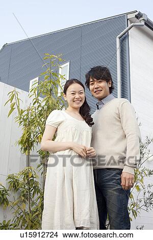 Young Couple Outside House View Large Photo Image Picture - Young Couple Outside House. Fotosearch