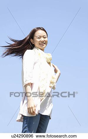 Stock Photograph - Young Man Against Blue Sky. Fotosearch