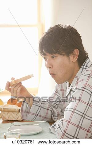 Young Man Having Breakfast View Large Photo Image Stock Image - Young Man Having Breakfast. Fotosearch