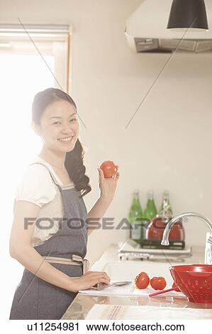 Young Woman Cooking View Large Photo Image Stock Image - Young Woman Cooking. Fotosearch