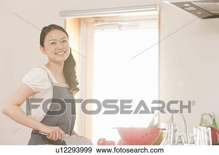 Young Woman Cooking View Large Photo Image Stock Photo - Young Woman Cooking. Fotosearch