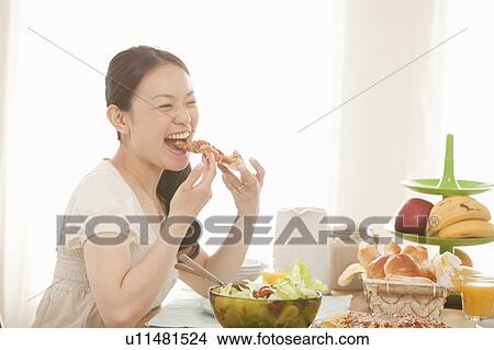 Young Woman Eating View Large Photo Image Picture - Young Woman Eating. Fotosearch