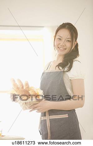 Young Woman Holding Bread Basket View Large Photo Image Stock Image - Young Woman Holding Bread Basket. Fotosearch