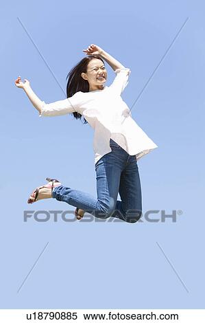 Young Woman Jumping View Large Photo Image Stock Photography - Young Woman Jumping. Fotosearch