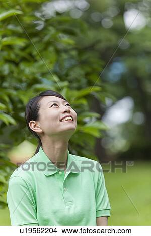 Young Woman Looking Up View Large Photo Image Picture - Young Woman Looking Up. Fotosearch