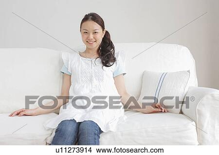 Young Woman on Sofa View Large Photo Image Picture - Young Woman on Sofa. Fotosearch