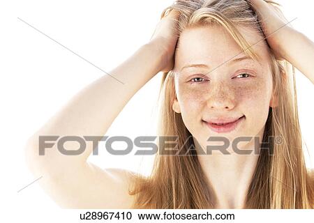 Young woman with a hand in hair View Large Photo Image Stock Image - Young woman with a hand in hair. Fotosearch