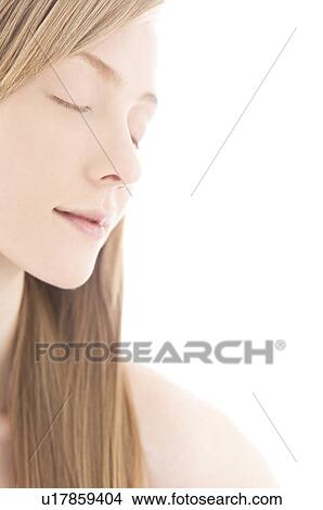 Young woman with eyes closed View Large Photo Image Picture - Young woman with eyes closed. Fotosearch