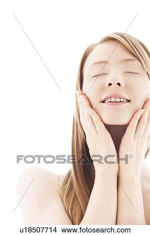 Picture - Young woman with eyes closed. Fotosearch