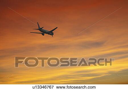 Airplane at Dusk View Large Photo Image Stock Photo - Airplane at Dusk. Fotosearch