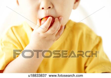 Stock Photo - Baby Boy Eating. Fotosearch