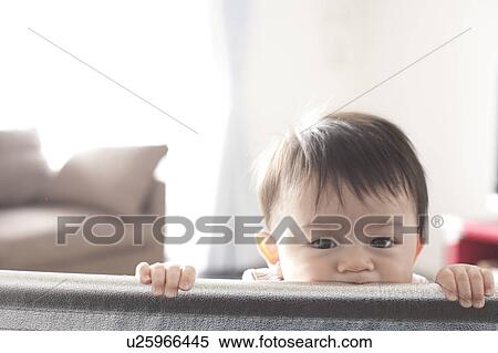 Baby Boy Peeking Behind from Sofa View Large Photo Image Stock Photography - Baby Boy Peeking Behind from Sofa. Fotosearch