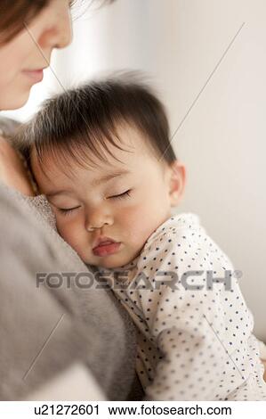 Baby Boy Sleeping in Mothers Arms View Large Photo Image Stock Image - Baby Boy Sleeping in Mothers Arms. Fotosearch