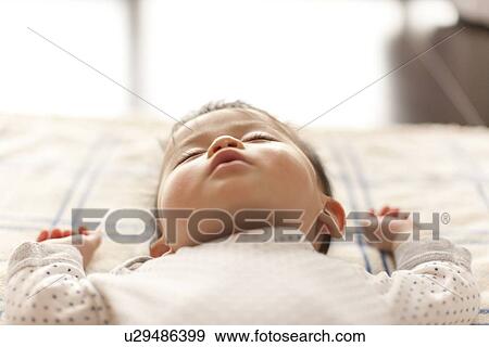Stock Photo - Baby Boy Sleeping. Fotosearch
