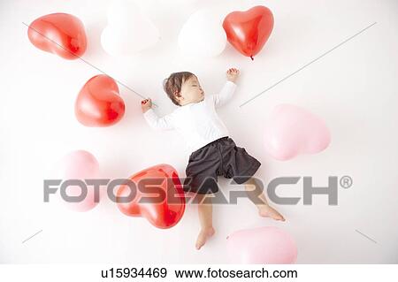 Baby in Midst of Balloons View Large Photo Image Stock Photo - Baby in Midst of Balloons. Fotosearch