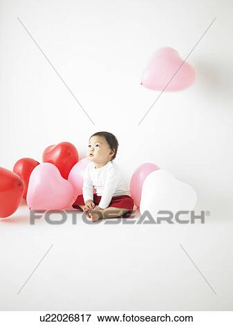 Baby in Midst of Balloons View Large Photo Image Stock Photo - Baby in Midst of Balloons. Fotosearch