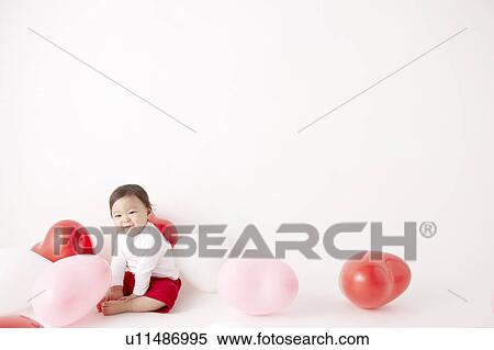 Baby in Midst of Balloons View Large Photo Image Stock Photography - Baby in Midst of Balloons. Fotosearch