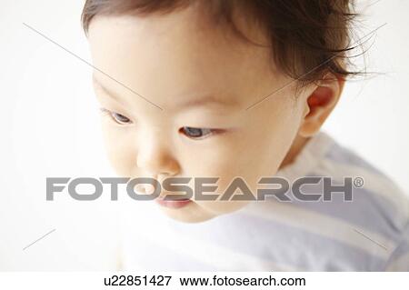 Stock Photo - Baby Looking Down. Fotosearch