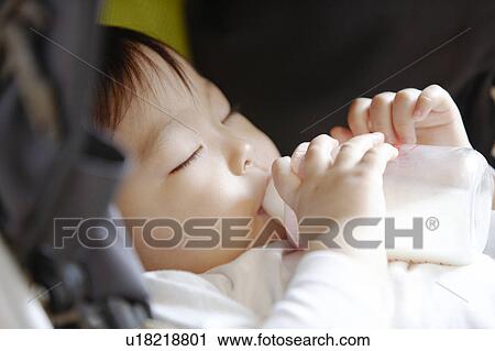 Baby Sucking Baby Bottle View Large Photo Image Stock Image - Baby Sucking Baby Bottle. Fotosearch