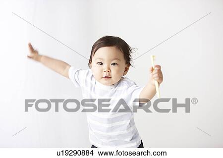 Picture - Baby with Toothbrush. Fotosearch