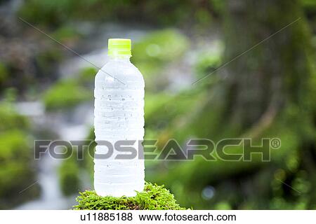 Stock Photo - Bottle on Moss. Fotosearch
