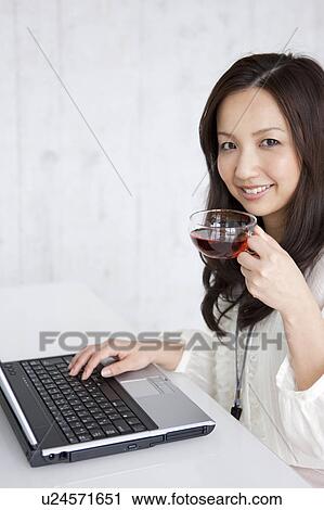 Businesswoman drinking tea View Large Photo Image Stock Image - Businesswoman drinking tea. Fotosearch