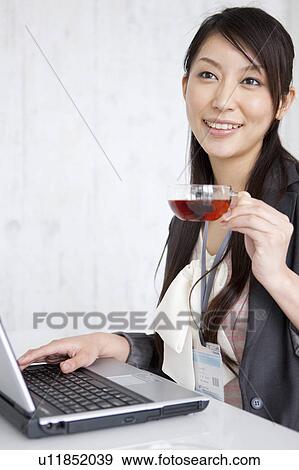 Businesswoman drinking tea View Large Photo Image Stock Photo - Businesswoman drinking tea. Fotosearch
