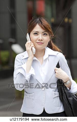 Businesswoman on cell phone View Large Photo Image Picture - Businesswoman on cell phone. Fotosearch