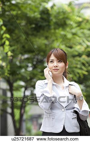 Businesswoman on cell phone View Large Photo Image Stock Photo - Businesswoman on cell phone. Fotosearch