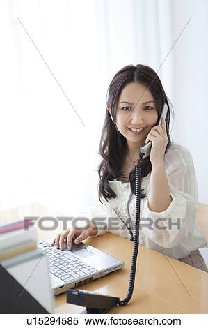 Businesswoman on landline phone View Large Photo Image Stock Photography - Businesswoman on landline phone. Fotosearch