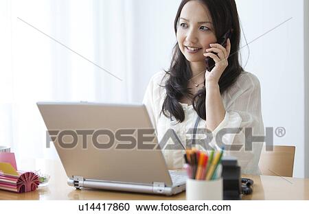 Businesswoman on mobile phone View Large Photo Image Stock Image - Businesswoman on mobile phone. Fotosearch