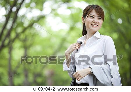 Businesswoman standing outdoors View Large Photo Image Stock Image - Businesswoman standing outdoors. Fotosearch