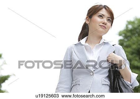 Businesswoman standing outdoors View Large Photo Image Stock Image - Businesswoman standing outdoors. Fotosearch