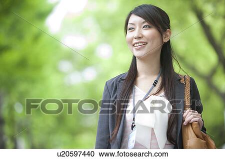 Businesswoman standing outdoors View Large Photo Image Stock Image - Businesswoman standing outdoors. Fotosearch