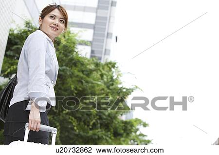 Businesswoman standing outdoors View Large Photo Image Stock Image - Businesswoman standing outdoors. Fotosearch