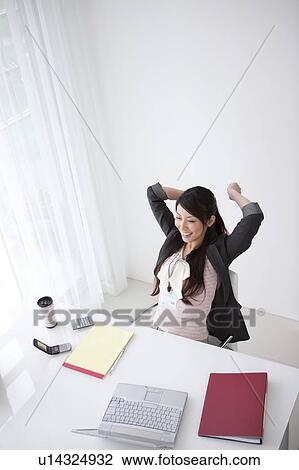 Businesswoman stretching View Large Photo Image Stock Image - Businesswoman stretching. Fotosearch