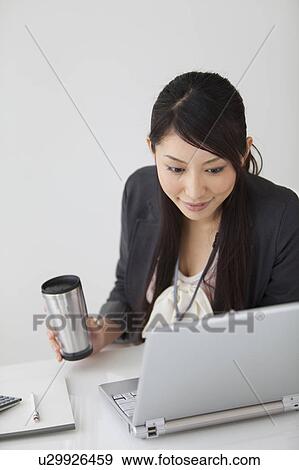 Businesswoman using laptop View Large Photo Image Stock Photo - Businesswoman using laptop. Fotosearch
