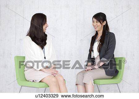 Businesswomen having a meeting View Large Photo Image Stock Photo - Businesswomen having a meeting. Fotosearch