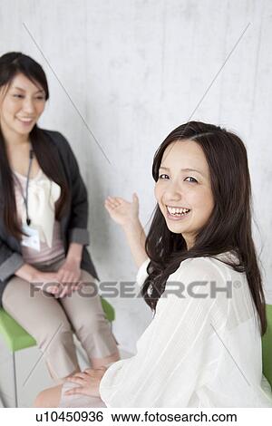 Stock Photograph - Businesswomen having a meeting. Fotosearch