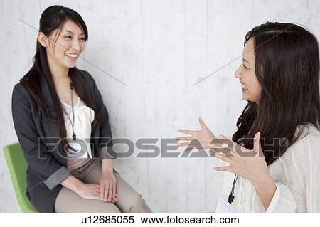 Stock Photography - Businesswomen having a meeting. Fotosearch