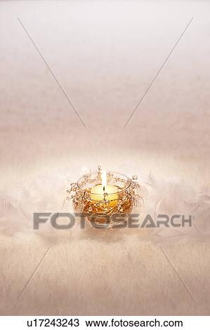 Stock Image - Candle and Snow. Fotosearch