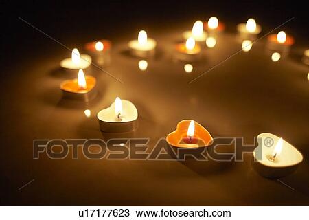 Stock Image - Candles Forming Heart Shape. Fotosearch