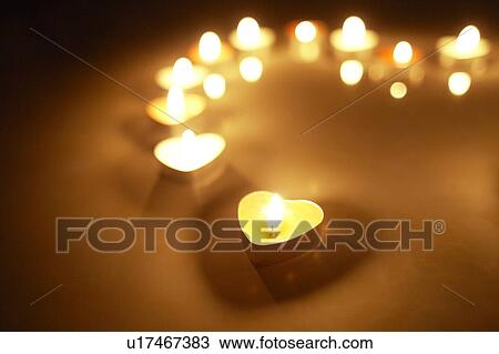Stock Image - Candles Forming Heart Shape. Fotosearch