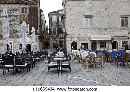 Picture - Chairs and Tables in Town Square. Fotosearch