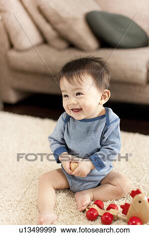 Cheerful Baby Boy with Toys View Large Photo Image Stock Photo - Cheerful Baby Boy with Toys. Fotosearch