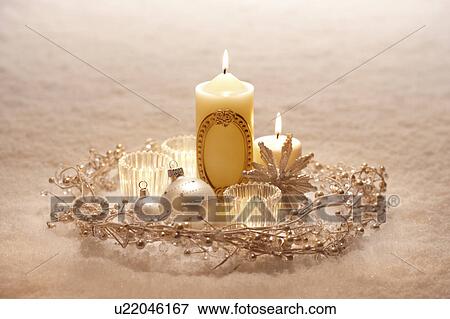 Stock Photo - Christmas Candles and Snow. Fotosearch