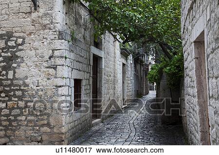 Stock Photo - Cobblestoned Alley in Trogir. Fotosearch