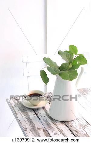 Stock Image - Coffee and Pitcher with Lemon Grass. Fotosearch