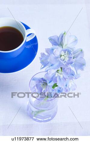 Stock Photo - Coffee and Vase of Flowers. Fotosearch